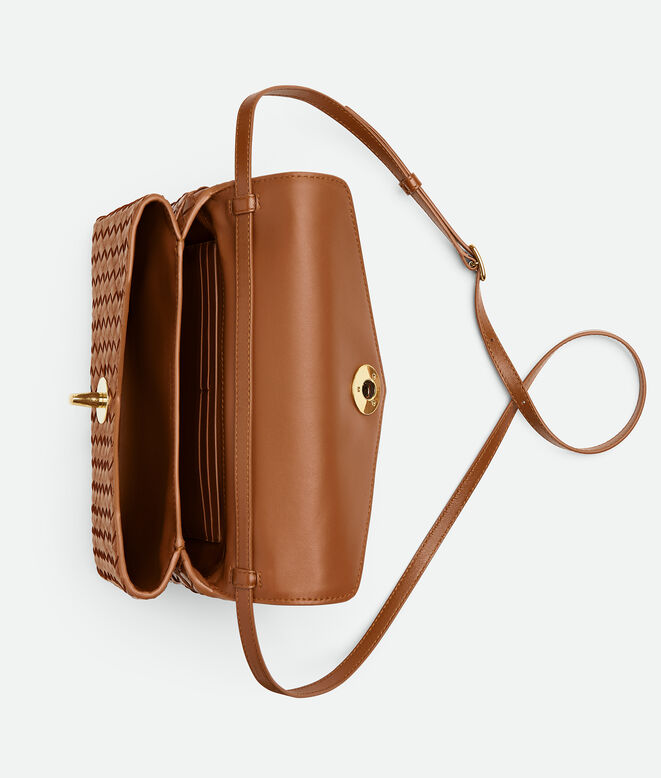 Cross-body bag in Intrecciato piccolo leather with adjustable top handle and sculptural knot closure., , hi-res
