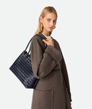 Top handle bag in Intrecciato leather with signature knot detail and sliding cross-body strap., , hi-res