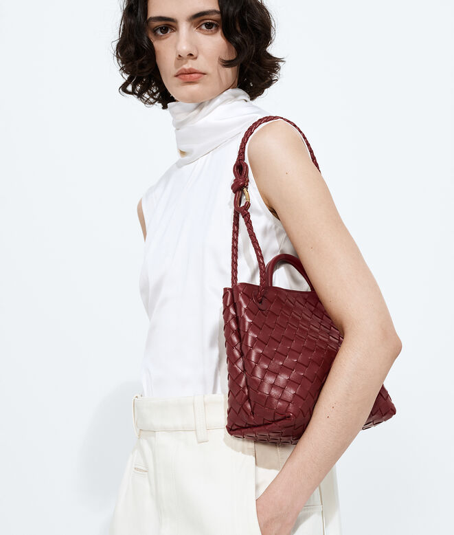 Top handle bag in supple Intrecciato leather, featuring a smooth leather covered signature knot detail and sliding cross-body strap., , hi-res