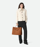 Top handle bag in Intrecciato suede with signature knot detail and sliding cross-body strap., , hi-res