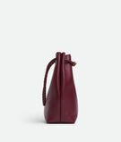 Bucket bag in silky calf leather with signature knot detail and sliding shoulder strap., , hi-res