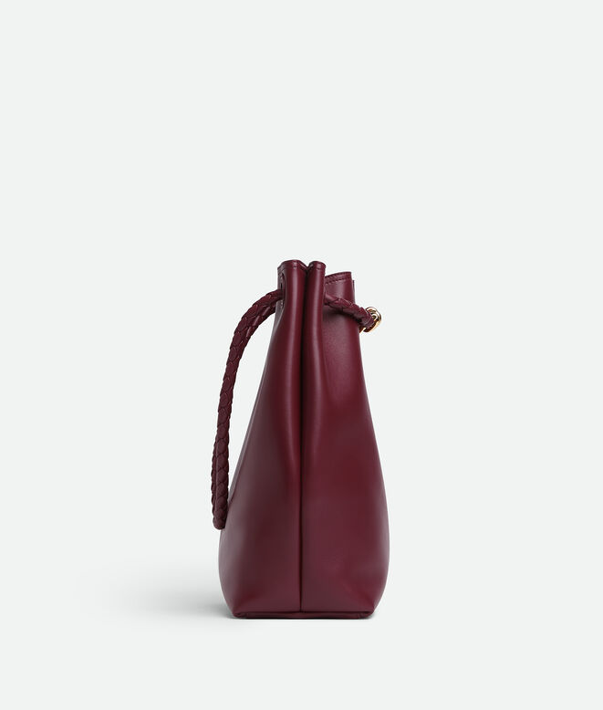 Bucket bag in silky calf leather with signature knot detail and sliding shoulder strap., , hi-res