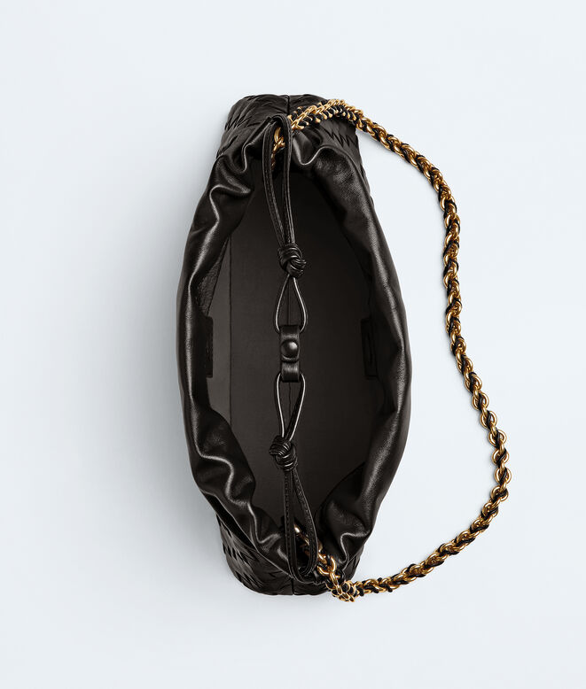 Dustbag in Intrecciato calf leather with tubular leather braided metal chain. Features a drawsting closure and loop attachment for shoulder carry., , hi-res
