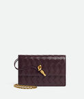 Pouch in Intrecciato nappa leather with signature knot closure and metal chain.