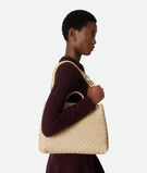 Top handle bag in supple Intrecciato leather with signature knot detail and sliding cross-body strap., , hi-res